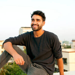 Side view portrait of a beautifull smiling man indian ethnicity Side view portrait of a beautifull smiling man indian ethnicity
